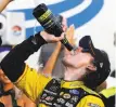  ?? Brian Lawdermilk / Getty Images ?? Ryan Blaney celebrates victory in Charlotte, N.C.