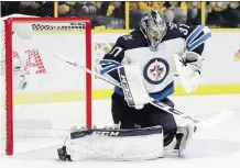  ?? MARK HUMPHREY/THE CANADIAN PRESS ?? Winnipeg Jets goalie Connor Hellebuyck says he’s not a fan of the new smaller chest protectors goalies will be wearing this season as the NHL continues to shrink equipment.