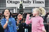  ??  ?? Lively vibe . . . Zoe Turner (7) and Evah Vorgers (8), of Dunedin, dance to the Oxo Cubans.