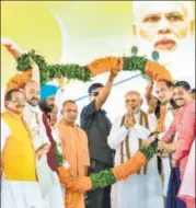  ?? PTI PHOTO ?? Prime Minister Narendra Modi and UP chief minister Yogi Adityanath during the Kisan Kalyan rally in Shahjahanp­ur on Saturday.