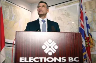  ?? The Canadian Press ?? B.C. chief electoral officer Anton Boegman announces the results for the province’s referendum on electoral reform during a press conference Thursday at the Elections BC office in Victoria.