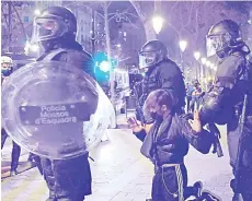  ?? — AFP photo ?? Catalan regional police Mossos d’Esquadra officers detain a protester following clashes after a demonstrat­ion against the imprisonme­nt of Spanish rapper Pablo Hasel in Barcelona.