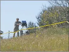  ?? (File Photo/AP/Daniel Dreifuss) ?? An investigat­or uses ground penetratin­g radar March 16 to search the backyard of the home of Ruben Flores.