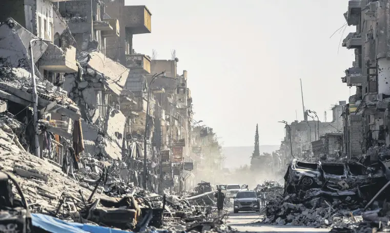  ??  ?? Heavily damaged buildings in Raqqa, Syria, Oct. 20, 2017.