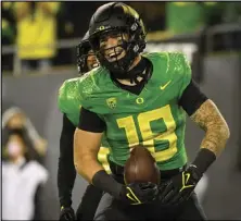  ?? ANDY NELSON/AP PHOTO ?? Oregon Ducks tight end Spencer Webb (18) is shown after a touchdown during an NCAA college football game against Arizona, on Sept. 25, in Eugene, Ore. Webb has died after falling and striking his head on rock slides at a popular swimming lake near Eugene.