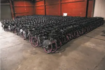  ?? Josie Norris / The Chronicle ?? A resolution of a lawsuit filed by Lyft against San Francisco could give the company the right to deploy its idled electric bike rental fleet, stored in a Dogpatch warehouse, on city streets.