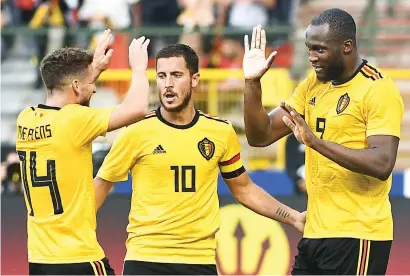  ?? Picture: AFP ?? HIGH FIVES. Romelu Lukaku (right) celebrates with Belgian team-mates Dries Mertens and Eden Hazard after scoring in an internatio­nal friendly against Costa Rica in Brussels on Monday.