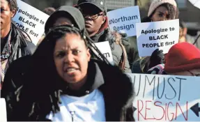  ?? STEVE HELBER/AP ?? Demonstrat­ors demand an apology and the resignatio­n of Ralph Northam outside the Virginia Governor’s Mansion this month in Richmond.