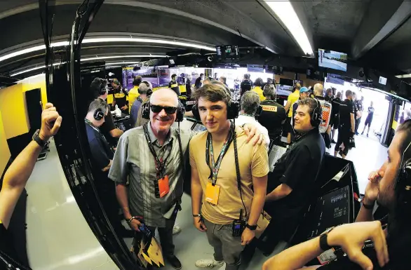  ?? INFINITI/RENAULT ?? Columnist Andrew McCredie and his son Callum watch last weekend’s Canadian Grand Prix in Montreal unfold from inside the Renault Sport F1 team garage.