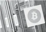  ?? Mark Lennihan / Associated Press file ?? An agreement to upgrade the speed of processing transactio­ns sent the digital currency bitcoin to a record high of $2,690 on Thursday.