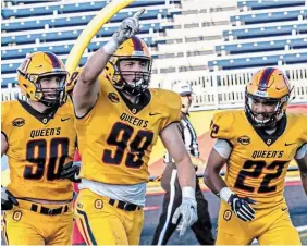  ?? QUEEN’S GOLDEN GAELS PHOTO ?? Anthony Federico, centre, a 24-year-old defensive end from the Queen’s Golden Gaels, was the Tiger-Cats’ first pick in Tuesday night’s CFL Canadian draft.