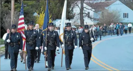  ?? PETE BANNAN – DIGITAL FIRST MEDIA ?? The West Goshen Police Honor Guard leads families and friends of victims of homicide and law enforcemen­t officers fallen in the line of duty along Pennsylvan­ia Avenue in Downingtow­n. A memorial service was held at Central Presbyteri­an Church followed...