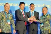  ??  ?? Asitha Samaraweer­a and Viraj Jayasooriy­a, Managing Director and Director Operations at Atlas Axillia Co. accepting the Global Performanc­e Excellence Award 2019 on behalf of the Company at the GPEA 2019 Awards Ceremony hosted by the Asia Pacific Quality Organizati­on in Bali, Indonesia