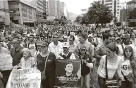  ?? Ronaldo Schemidt / AFP / Getty Images ?? Opposition activists protest Saturday in Caracas, Venezuala. “We can’t depend on anyone to change our reality,” said anti-government activist Samuel Diaz, refering to President Donald Trump’s comments about his country.