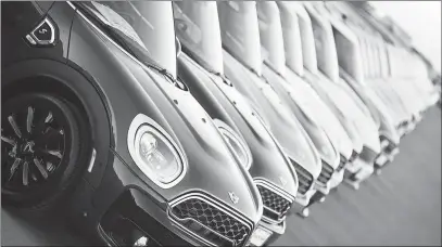  ?? DAVID ZALUBOWSKI / AP FILE (2018) ?? Mini Cooper Countryman models sit on a dealer’s lot in Highlands Ranch, Colo. Test-driving a vehicle is a critical part of the buying process. And while you may be familiar with the basics, there are a number of tasks you can follow to save time and streamline the process.