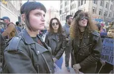  ?? Calvin B. Alagot For The Times ?? GAVIN, left, Maskin and McPherson were among the many people participat­ing in Saturday’s women’s march in downtown Los Angeles.