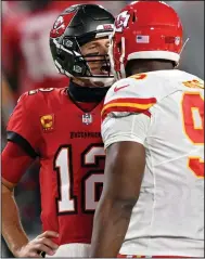  ?? (AP/Jason Behnken) ?? Tampa Bay Buccaneers quarterbac­k Tom Brady (12) exchanges words with Kansas City Chiefs defensive tackle Chris Jones during Sunday’s game. Brady passed for 345 yards and three touchdowns during the loss.
