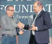  ?? HT PHOTO ?? Ajit Wadekar (right) was conferred the Dr Rameshwar Dayal Lifetime Achievemen­t Award in Mumbai on Thursday.