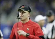  ?? AP PHOTO/CARLOS OSORIO, FILE ?? In this Dec. 26, 2016, file photo, Maryland head coach DJ Durkin walks the sideline during the first half of the Quick Lane Bowl NCAA college football game against Boston College in Detroit. Maryland placed the head of the football team’s strength and conditioni­ng staff on paid leave while it investigat­es claims he verbally abused and humiliated players, a person briefed on the situation said. The person spoke to The Associated Press on Saturday, Aug. 11, 2018, on condition of anonymity because Maryland had not announced the decision regarding Rick Court. The person says athletic director Damon Evans spoke with the football team Saturday morning and Durkin was still leading the program.