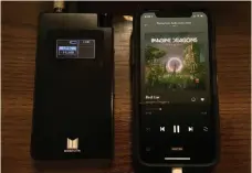  ??  ?? The Monolith portable headphone amplifier connected to an iphone XS. The two are comparable in size.