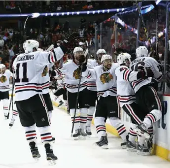  ?? STEPHEN DUNN/GETTY IMAGES ?? Chicago’s Game 2 victory over the Ducks in triple OT was their seventh win in their past eight overtimes.