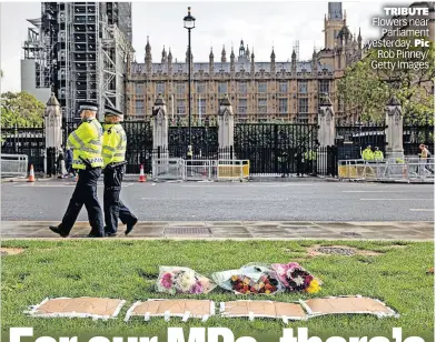  ?? ?? TRIBUTE Flowers near Parliament yesterday. Pic Rob Pinney/ Getty Images
