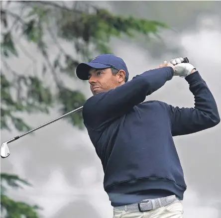  ?? JEFF CHIU/ AP ?? Rory McIlroy, hitting during practice for the PGA Championsh­ip on Tuesday, won four majors before he was 25.