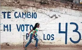  ?? Pedro Pardo
AFP/Getty Images ?? GRAFFITI in Guerrero state calls for a boycott of upcoming Mexican elections and refers to 43 college students who are missing and presumed massacred.