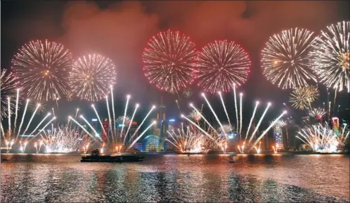  ?? WANG XI / XINHUA ?? Fireworks explode over Victoria Harbour during New Year celebratio­ns in Hong Kong on January 1, 2018.