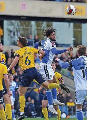  ?? ?? Rovers’Josh Grant gets above Oxford’s Alex Corrin to win a header