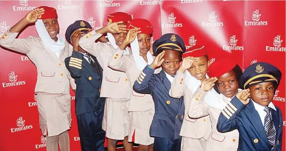  ??  ?? Children pose as pilots and cabin crew in Emirates uniform as the airline celebrates Children’s Day in Lagos… at the weekend. PHOTO: SUNDAY AKINLOLU