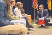  ?? MARLA BROSE/JOURNAL ?? PED Secretary-designate Christophe­r Ruszkowski, right, chats with a group of high-performing Rio Rancho High School seniors Wednesday before discussing student success on AP classes throughout New Mexico.