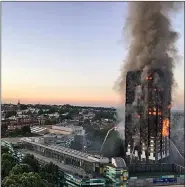  ??  ?? Toxic smoke entering the flaming building Of Grenfell Tower.