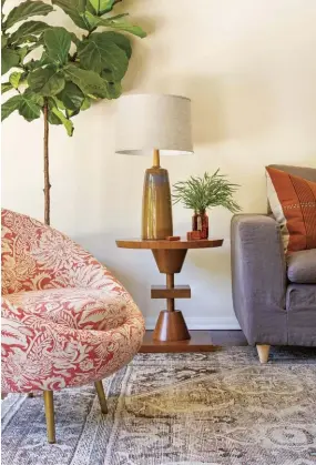  ??  ?? |ABOVE RIGHT| NATURAL WARMTH. “This side table is modern, but the material is a beautiful walnut that can be used in more traditiona­l settings,” Jennifer says. “It’s all about balance, so if we used a modern shape, we tried to make a compromise with the materials.”