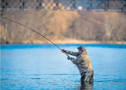  ?? Photograph by Jason Hedges ?? WAITING GAME: Anglers on the Spey fear a long-term decline in Atlantic salmon.