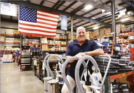  ?? Tyler Sizemore / Hearst Connecticu­t Media ?? Tim Kane, CEO and president of Goodway Technologi­es, which manufactur­es industrial-maintenanc­e products, stands on the production floor at Goodway’s headquarte­rs at 420 West Ave. in Stamford on Tuesday. In 2021, exports accounted for about 15 percent of the company’s revenues.