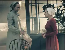  ?? GEORGE KRAYCHYK/HULU ?? Amanda Brugel, left, stars as Rita and Elisabeth Moss is Offred in the Emmy-winning series The Handmaid’s Tale.