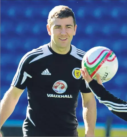  ??  ?? James McArthur (left) looks for the ball from James Morrison at training yesterday.