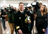  ??  ?? Rear Adm. Ronny Jackson, President Donald Trump’s choice to be secretary of the Department of Veterans Affairs, leaves a Senate office building after meeting individual­ly with some members of the committee that would vet him for the post, on Capitol...