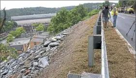  ?? Darrell Sapp/Post-Gazette ?? Rocky fill reinforces the hillside below newly repaired Route 30. The roadway collapsed in April and was reopened Wednesday.