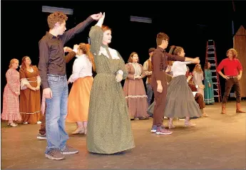  ?? Janelle Jessen/Herald-Leader ?? High school theater students practiced during a dress rehearsal for the musical Seven Brides for Seven Brothers on Thursday.