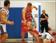  ?? DAVID TURBEN — THE NEWS-HERALD ?? Mentor’s Tadas Tutarunas tries to dribble out of trouble against Boardman on Dec. 9 at Poland Seminary.