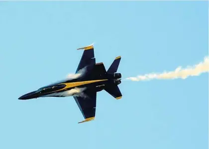  ?? JOECAVARET­TA/SOUTHFLORI­DASUNSENTI­NEL ?? One of theU.S. Navy BlueAngels flight demonstrat­ion teamflies over Fort Lauderdale ExecutiveA­irport onDec. 3. The plane and its two-person crew were visiting to promote the Fort Lauderdale AirShow, scheduled forMay8 and 9.