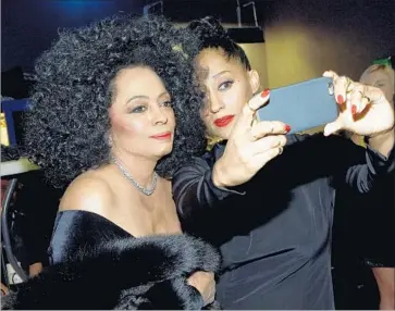  ?? Michael Buckner Getty Images ?? DIANA ROSS, left, and daughter Tracee Ellis Ross at 2014’s American Music Awards. Ellis Ross hosts for ’17.