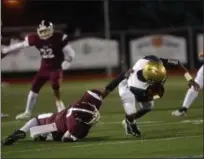  ?? TANIA BARRICKLO — DAILY FREEMAN ?? Kingston defender Kievaughn Evans-Wright takes down Newburgh’s Justin Barnhill during Tigers’ loss.