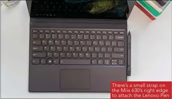  ??  ?? There’s a small strap on the Miix 630’s right edge to attach the Lenovo Pen