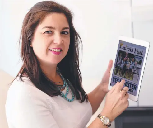  ??  ?? SO HANDY: Lianne Brown, business developmen­t and marketing adviser at MacDonnell­s Law, enjoys the Cairns Post. Picture: STEWART McLEAN