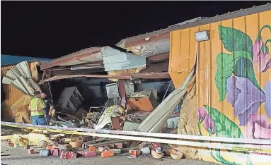  ?? BASELINE FLOWERS ?? “It looks like a hurricane went through it, honestly,” said Kathy Nakagawa, owner of Baseline Flowers, who arrived at her flower shop the night of April 21 to find it had been damaged after two cars crashed into the building.