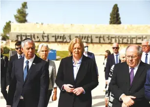  ?? (Ronen Zvulun/Reuters) ?? GERMAN PARLIAMENT President Baerbel Bas and Knesset Speaker Mickey Levy are accompanie­d by Yad Vashem Chairman Dani Dayan at the Holocaust Memorial yesterday.