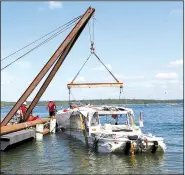  ?? AP/The Springfiel­d News-Leader/NATHAN PAPES ?? A duck boat is raised Monday from the bottom of Table Rock Lake in Branson.